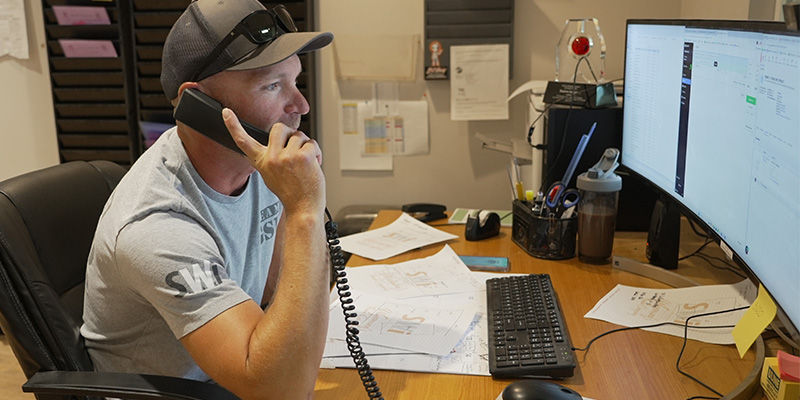 xxxCOMPANY team member talking on the phone